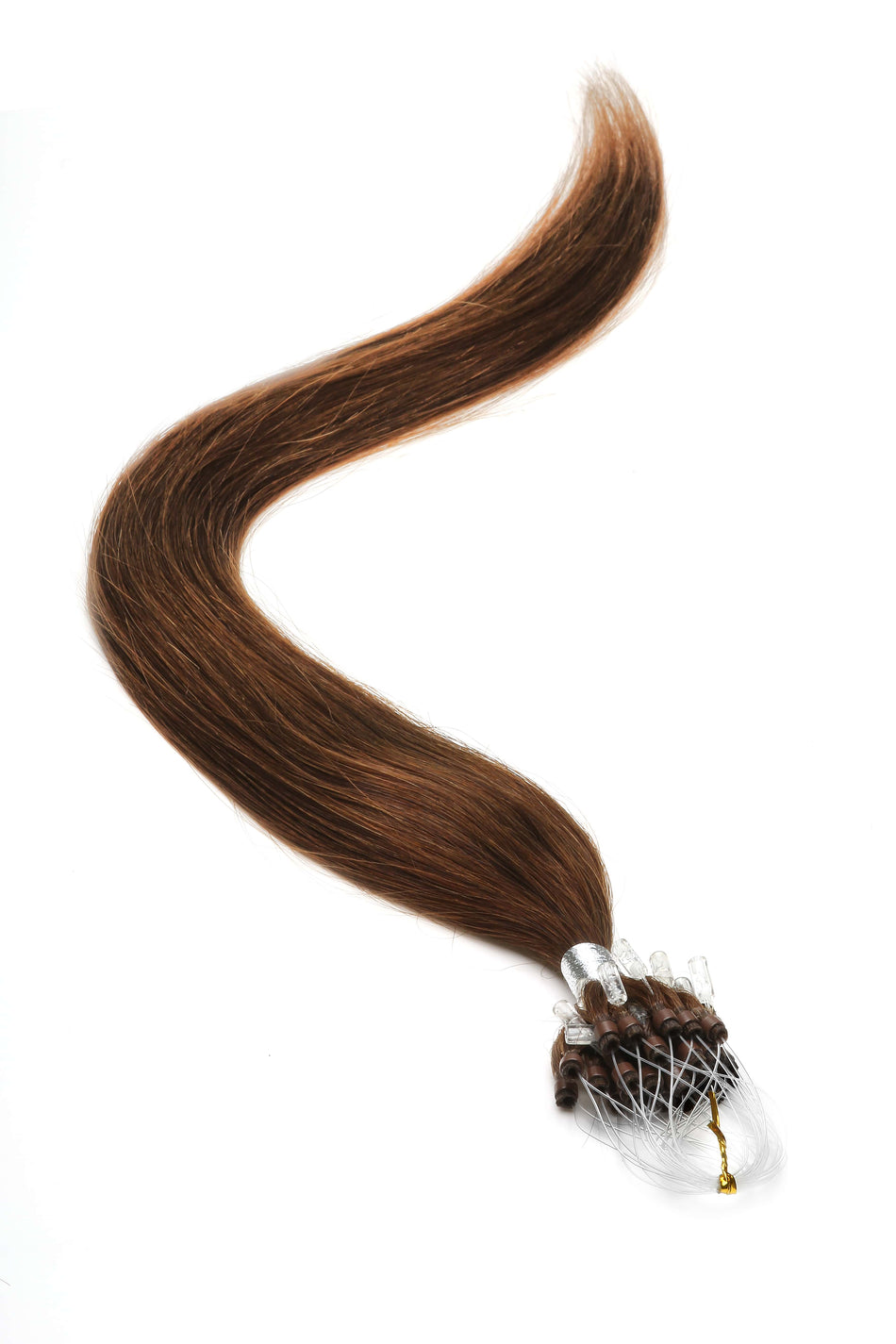 a piece of brown hair is laying on a white surface