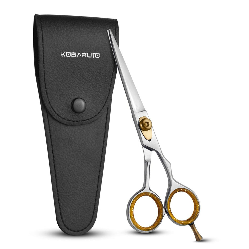 Kobaruto Professional Salon Barber Haircutting Scissors in premium leather case, showcasing ergonomic design and gold-accented finger inserts, ideal for precise cuts.