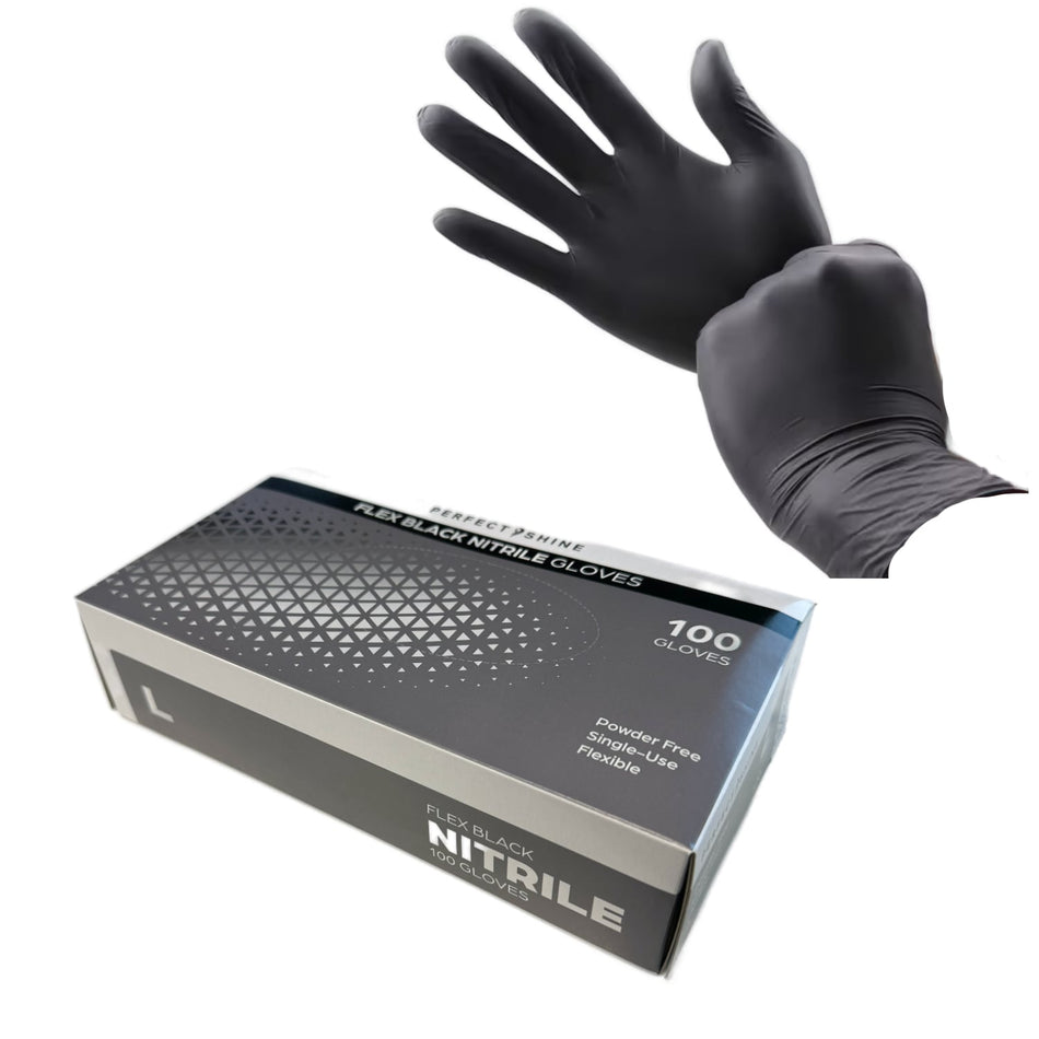 a pair of black gloves sitting on top of a box